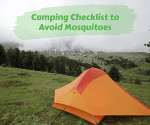 Camping Checklist to Avoid Mosquitoes. Orange tent set up in grass with trees in the background.